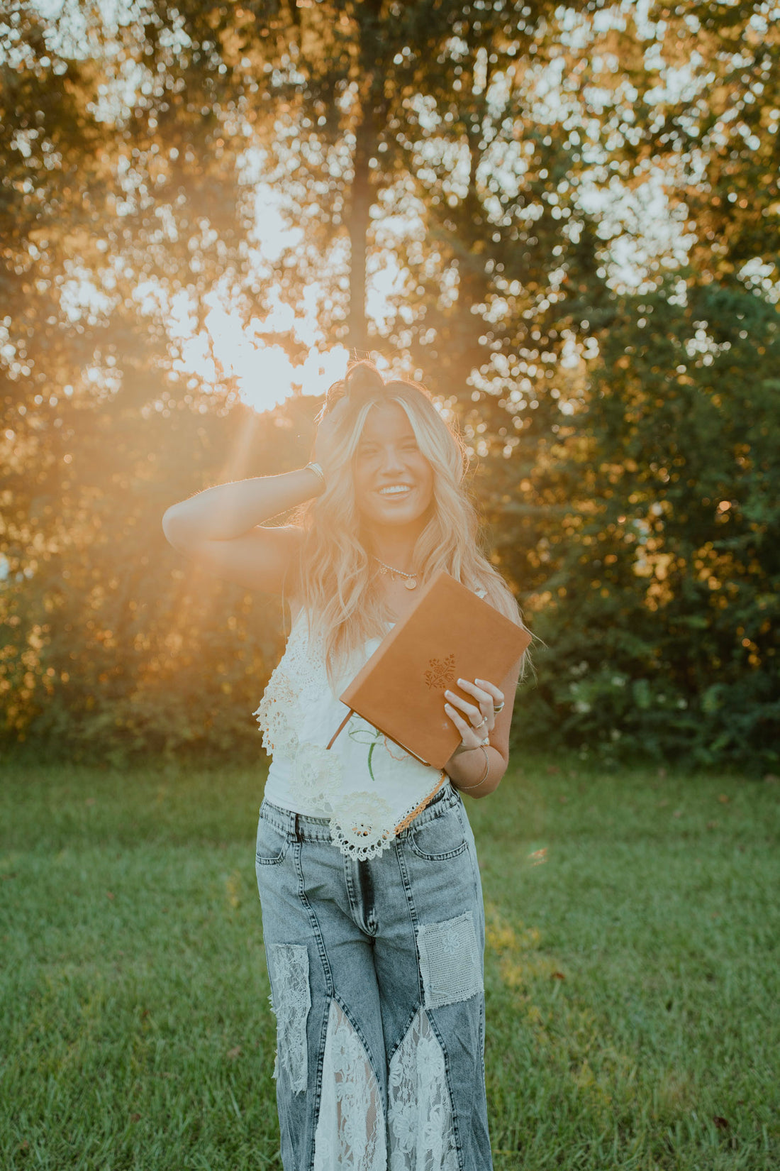 Amelia holding her Bible in golden sunlight